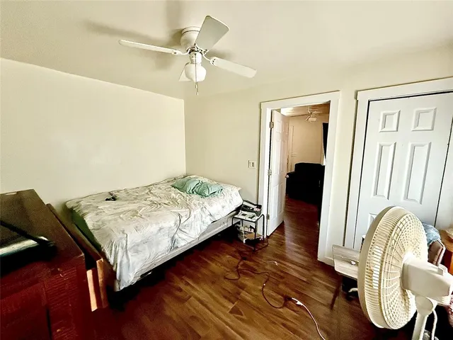 a bedroom with bed and a window