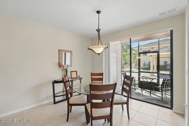 a bathroom with a granite countertop sink a mirror and shower