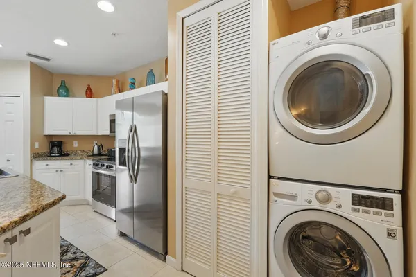 a view of a hallway with washer and dryer