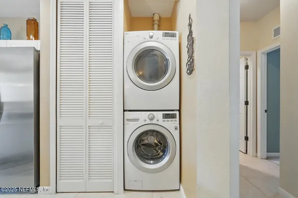 a bedroom with a bed and a dresser in it