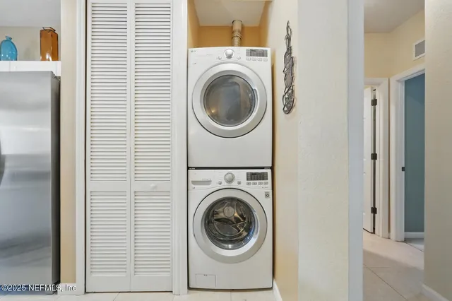 a spacious bathroom with a double vanity sink a mirror and shower