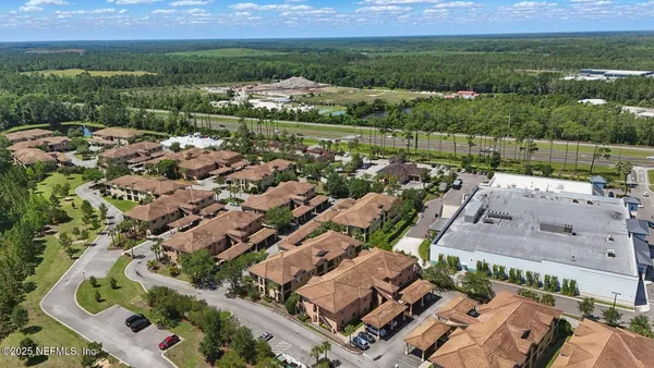 an aerial view of residential houses with outdoor space