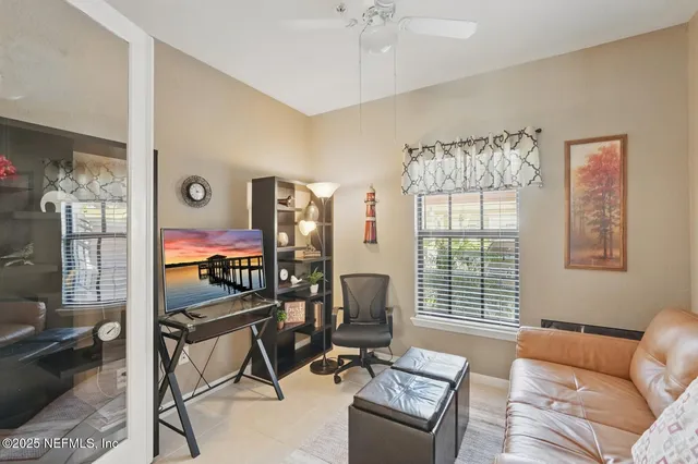 a bedroom with furniture and a window
