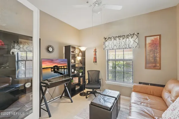 a bedroom with furniture and a window