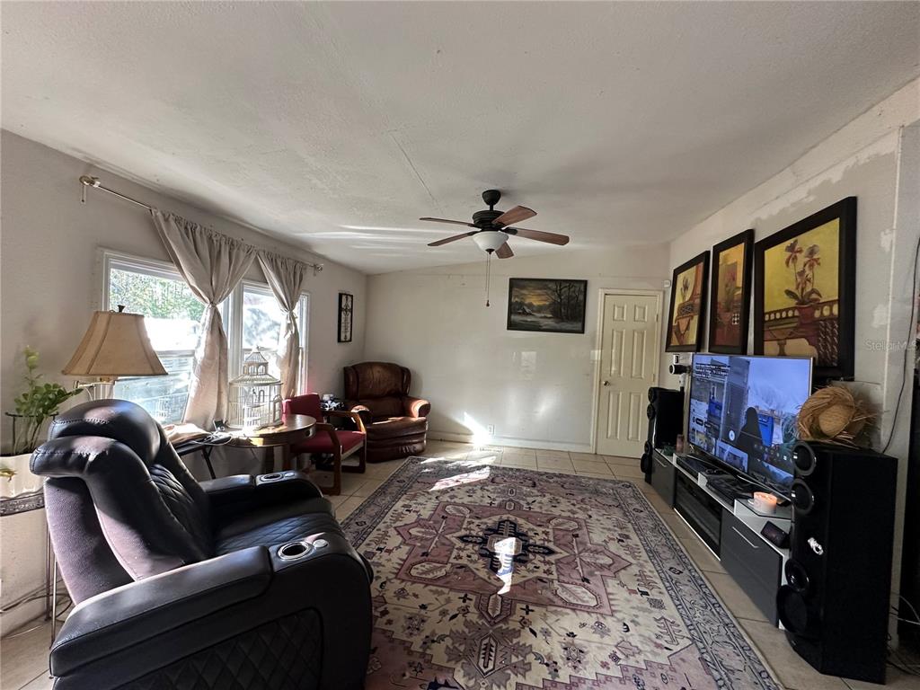 212 Ballard Road Avon Park, FL 33825 - Photo 13 of 22 a living room with furniture chess board and a fireplace