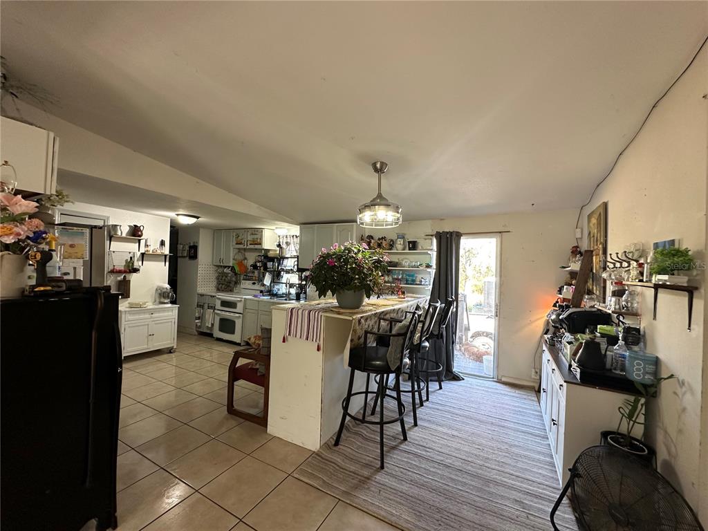 212 Ballard Road Avon Park, FL 33825 - Photo 7 of 22 a view of a dining room with furniture and wooden floor