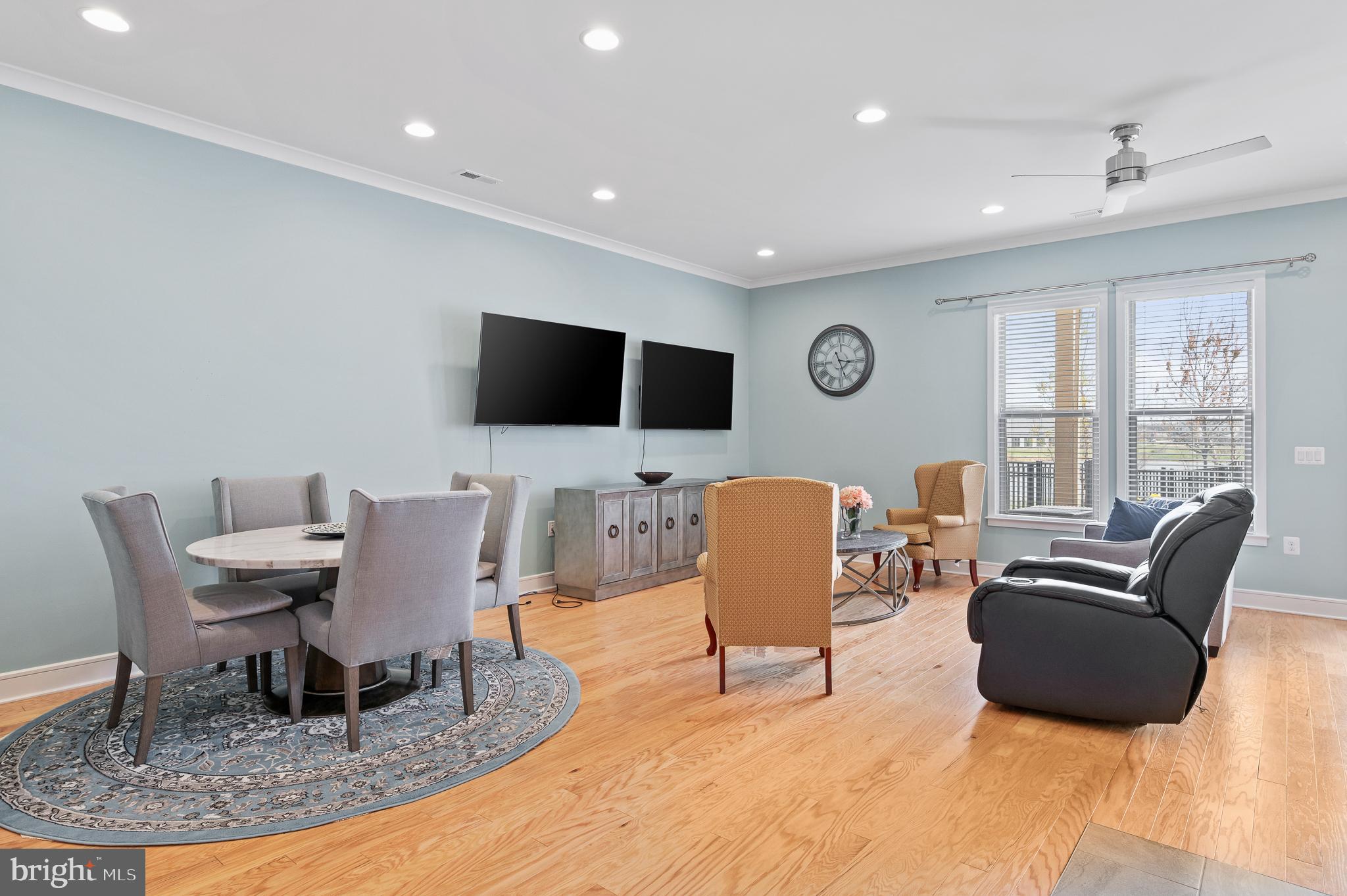 42791 Macbeth Terrace Ashburn, VA 20148 - Photo 10 of 63 a living room with furniture and a flat screen tv