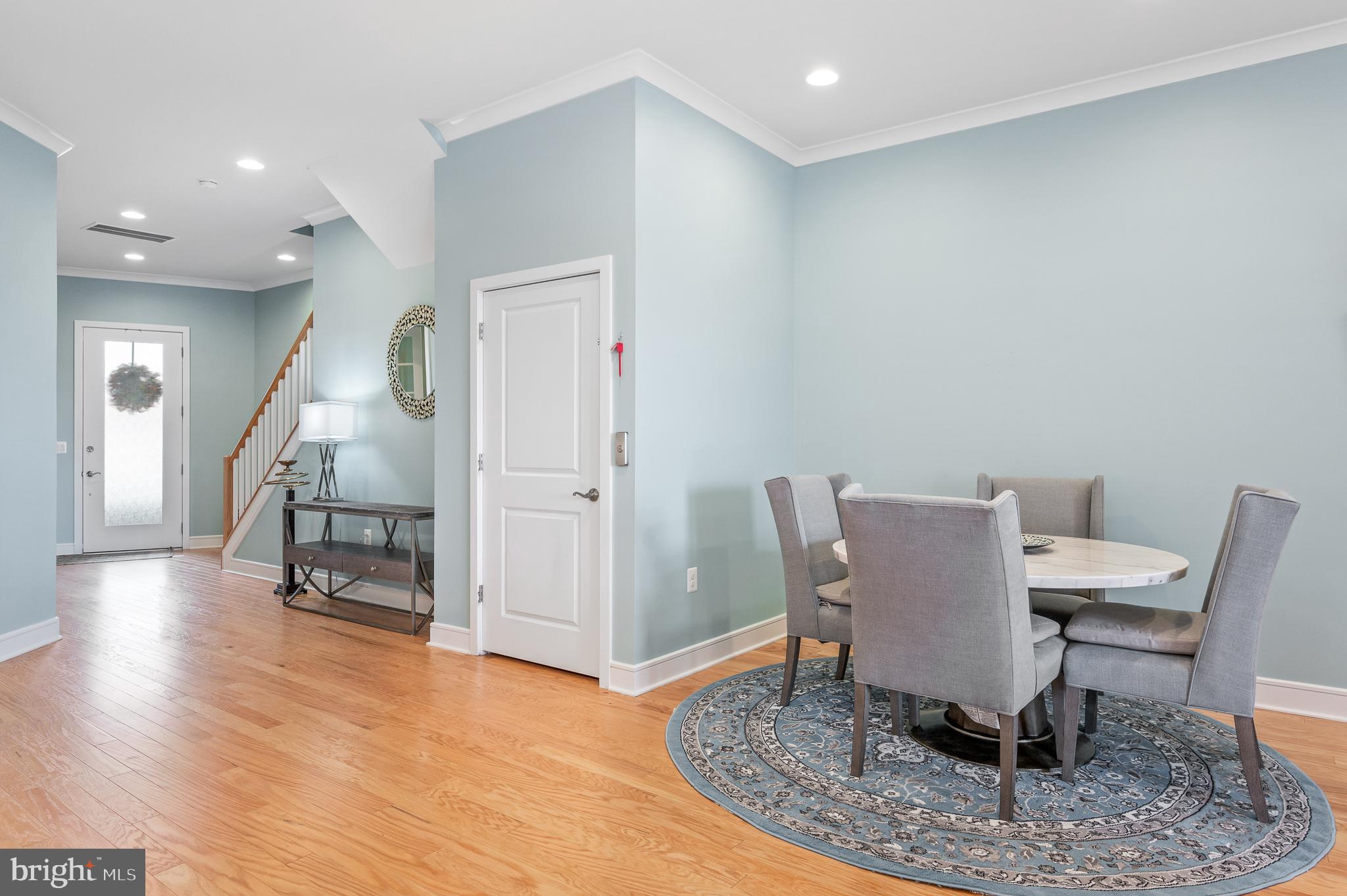 42791 Macbeth Terrace Ashburn, VA 20148 - Photo 11 of 63 a dining room with furniture and wooden floor