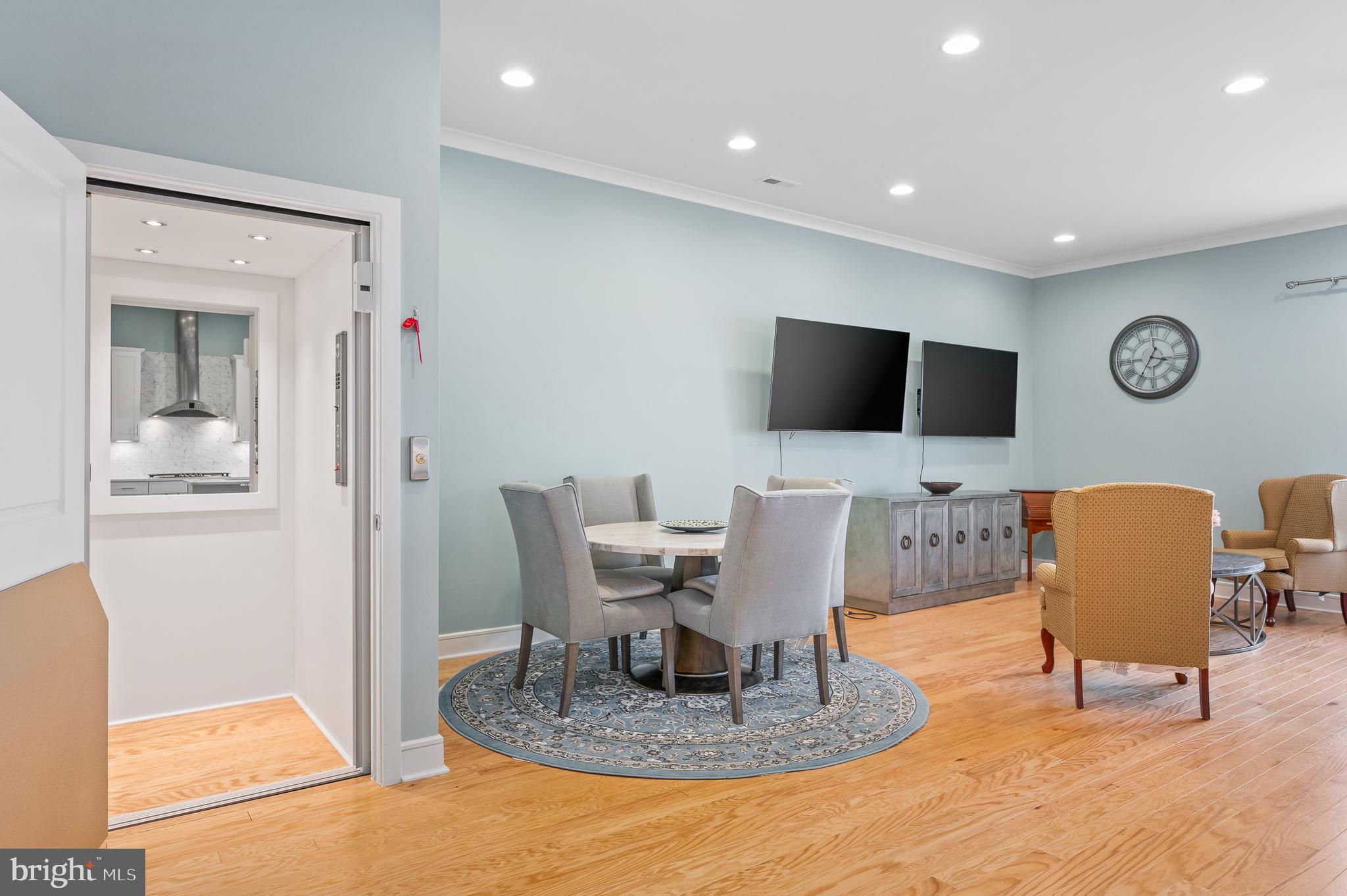 42791 Macbeth Terrace Ashburn, VA 20148 - Photo 14 of 63 a work room with furniture and a flat screen tv
