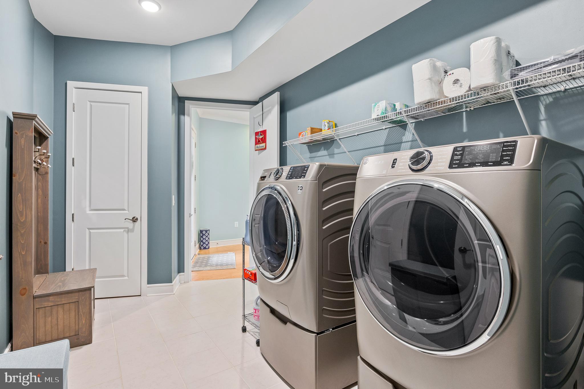 42791 Macbeth Terrace Ashburn, VA 20148 - Photo 18 of 63 a utility room with dryer and washer