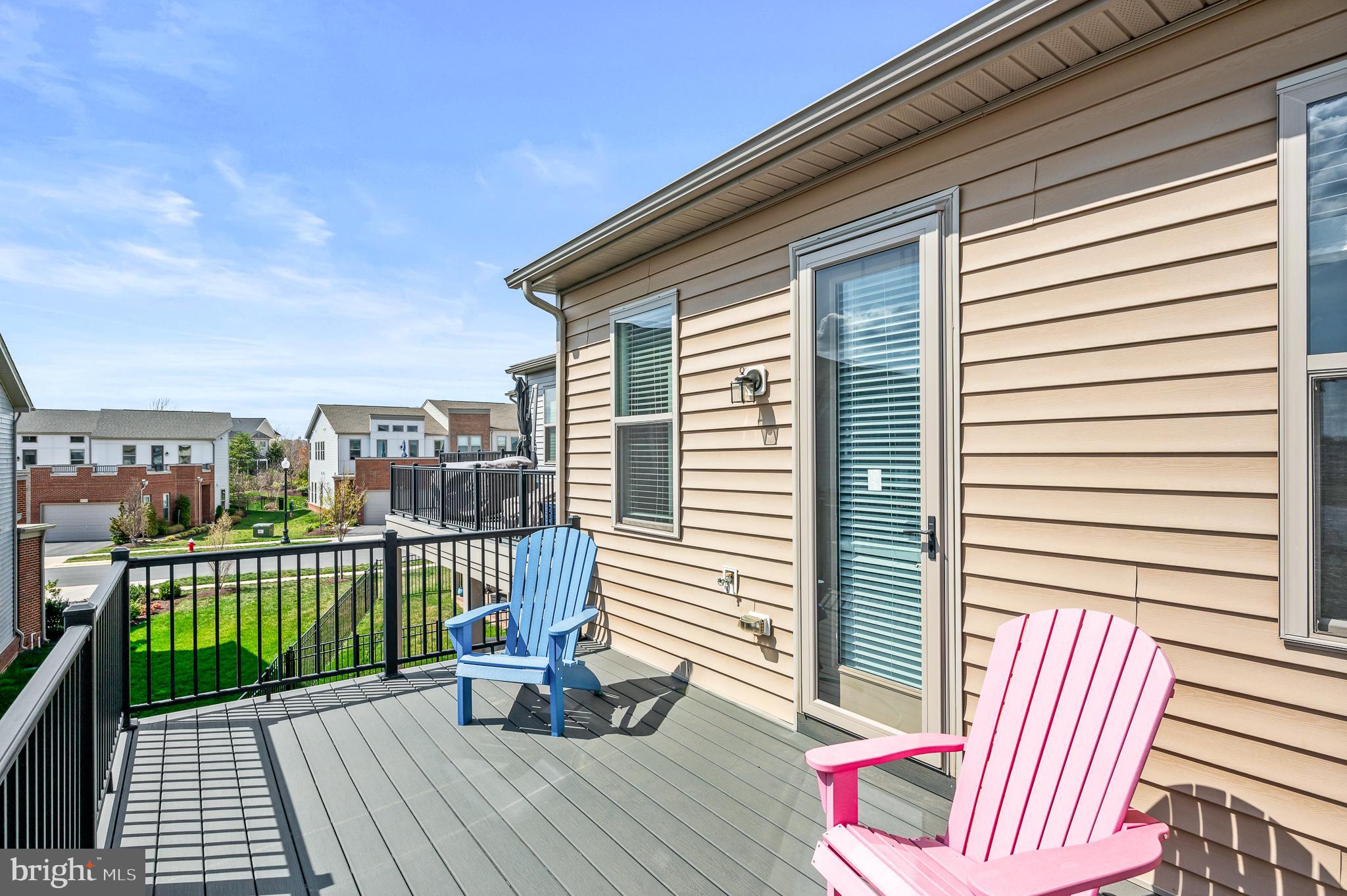 42791 Macbeth Terrace Ashburn, VA 20148 - Photo 28 of 63 a view of a deck with wooden floor and iron stairs