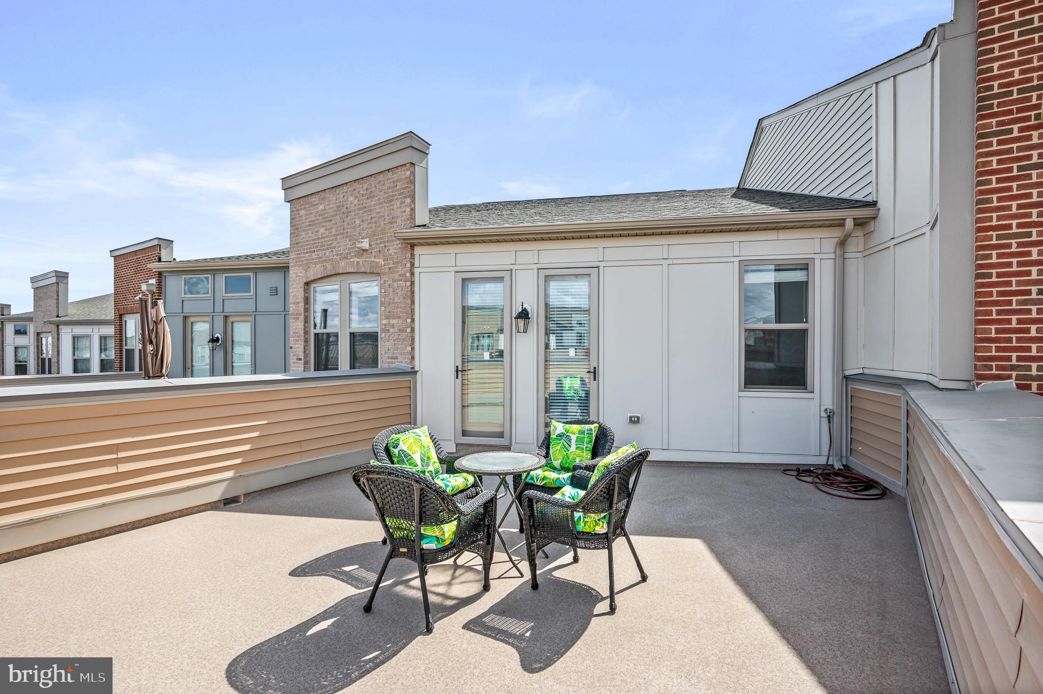 42791 Macbeth Terrace Ashburn, VA 20148 - Photo 37 of 63 a view of a patio with table and chairs and potted plants
