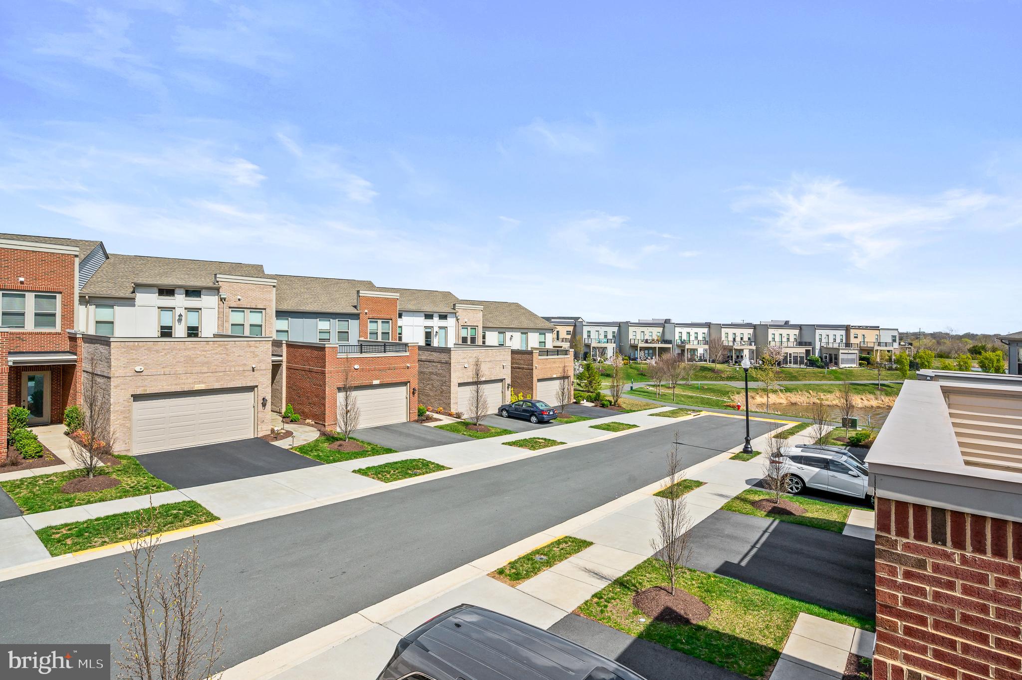 42791 Macbeth Terrace Ashburn, VA 20148 - Photo 38 of 63 a view of swimming pool with outdoor seating and city view