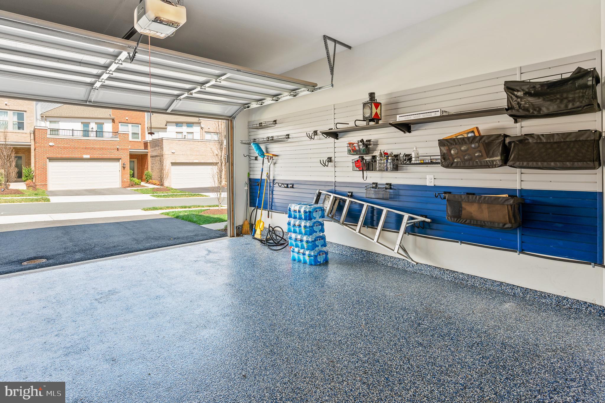 42791 Macbeth Terrace Ashburn, VA 20148 - Photo 51 of 63 a kitchen with stainless steel appliances a stove a sink and a window