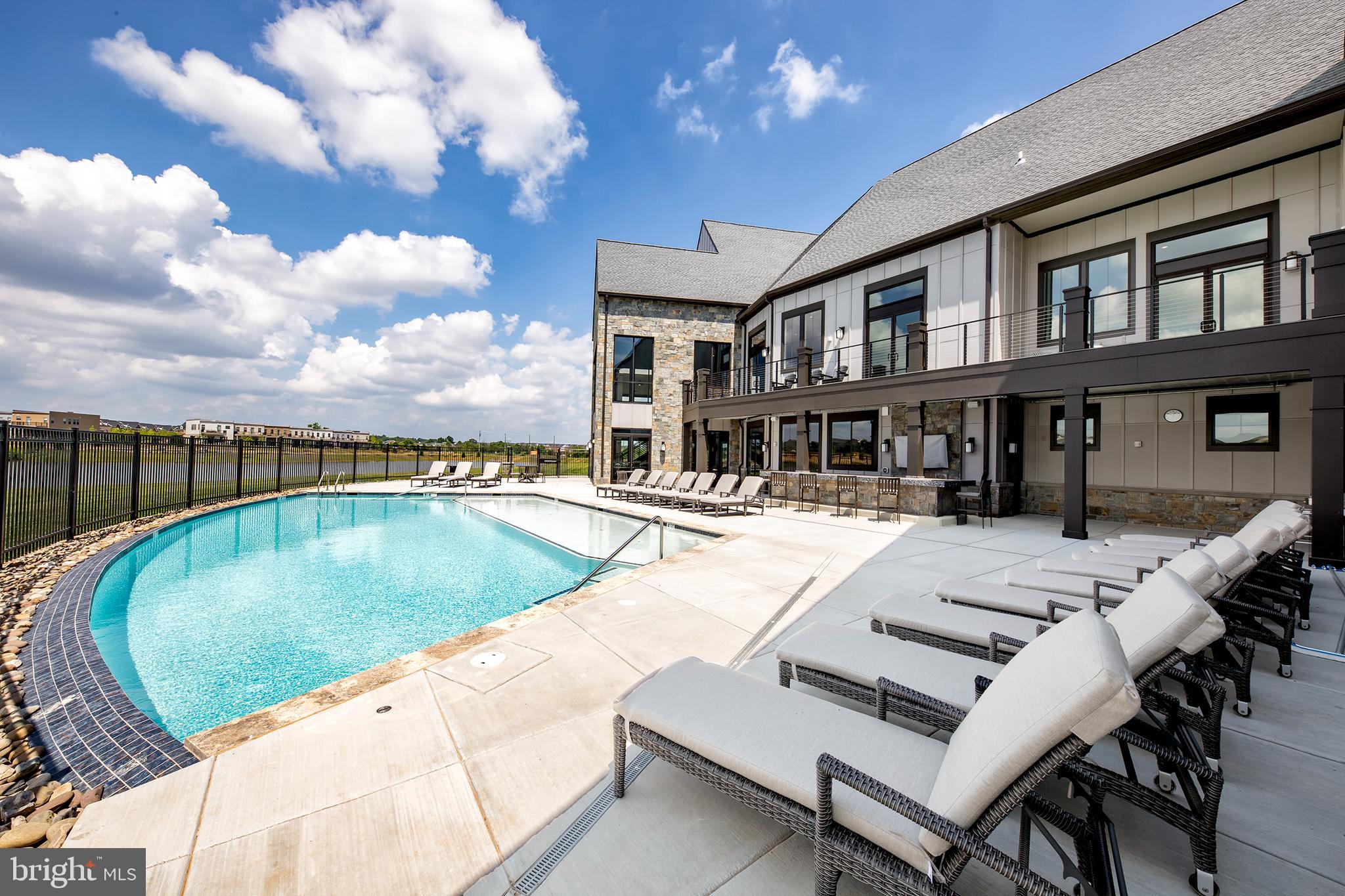 42791 Macbeth Terrace Ashburn, VA 20148 - Photo 62 of 63 a view of a house with swimming pool and sitting area