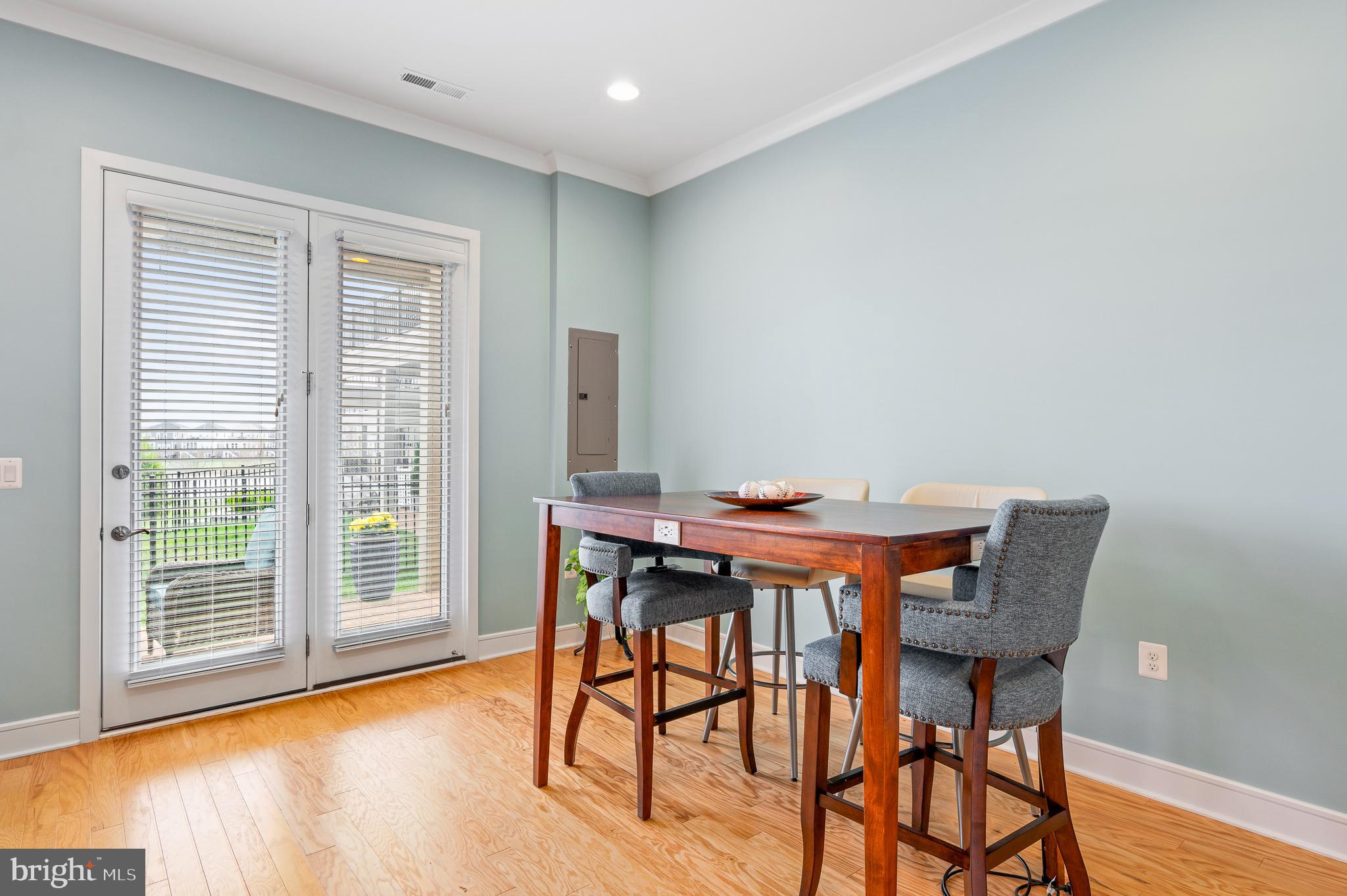 42791 Macbeth Terrace Ashburn, VA 20148 - Photo 9 of 63 a view of a dining room with furniture and wooden floor