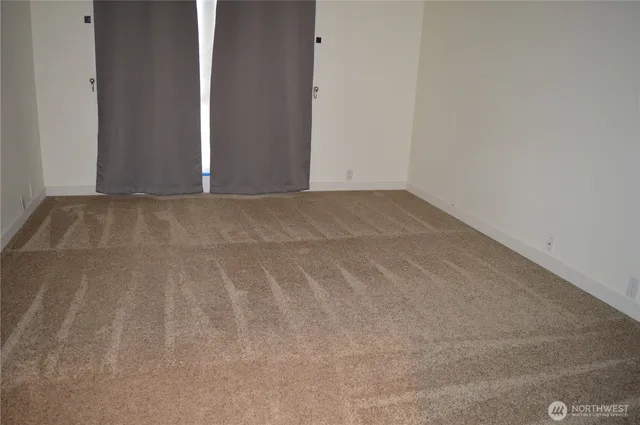 a bathroom with a granite countertop sink a toilet and bathtub