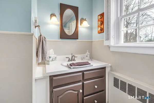 a bathroom with a sink and a mirror