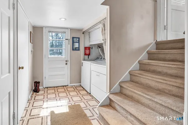 a view of entryway with a front door