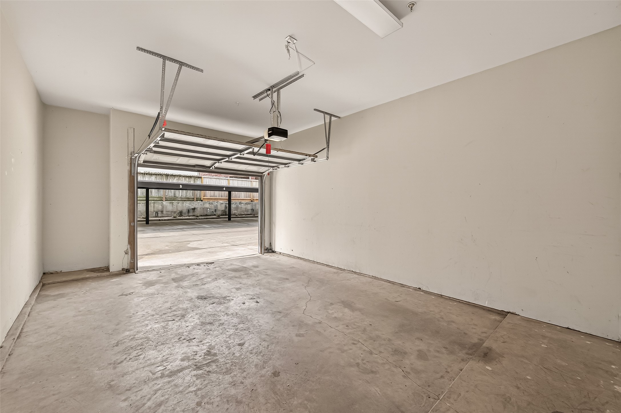 1441 East Street, Unit 308 Houston, TX 77007 - Photo 11 of 42 Private garage—first and closest to the entrance for convenience.