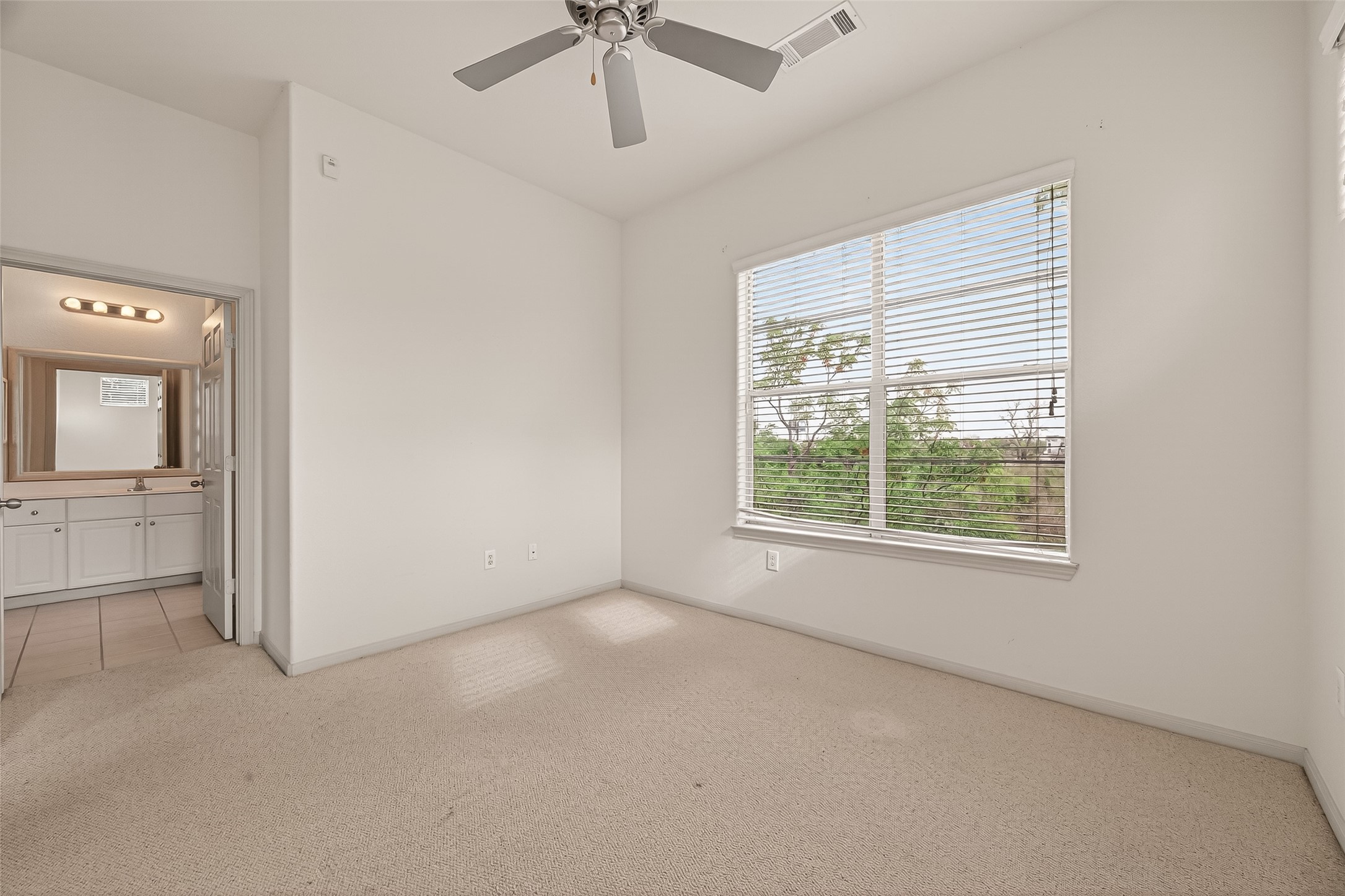 1441 East Street, Unit 308 Houston, TX 77007 - Photo 28 of 42 Generous natural light enhances the peaceful bedroom retreat.