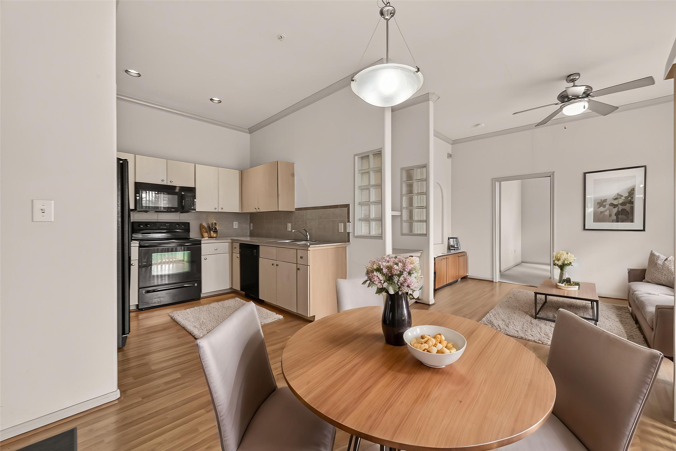 1441 East Street, Unit 308 Houston, TX 77007 - Photo 3 of 42 Light-filled entry leads you into an open and airy living space. This photo is virtually staged to show one possible configuration of furniture.