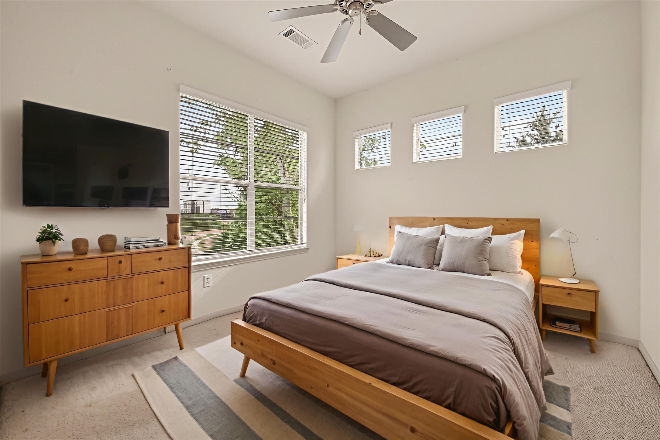 1441 East Street, Unit 308 Houston, TX 77007 - Photo 7 of 42 Comfortable bedroom with serene “tree top” views. This photo is virtually staged to show one possible configuration of furniture.