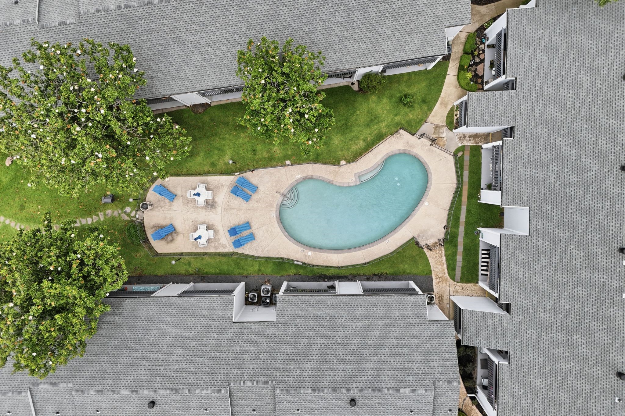 13151 Walden Road, Unit 131 Montgomery, TX 77356 - Photo 22 of 35 Community pool area designed for relaxation and outdoor enjoyment.