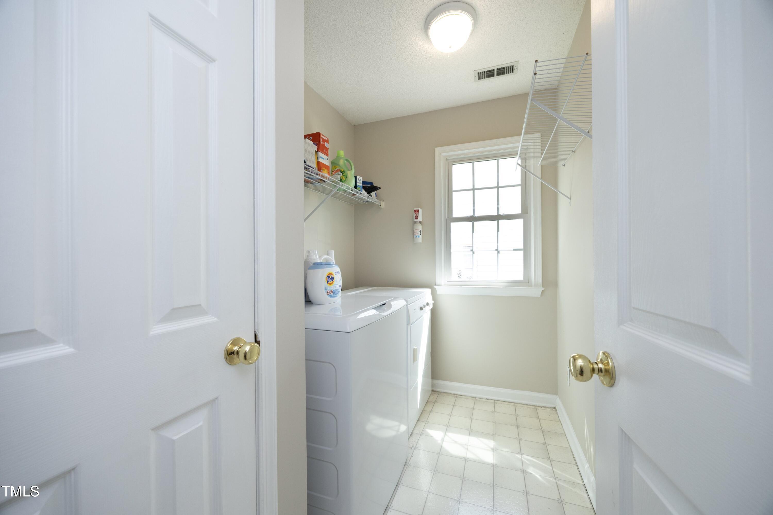 5513 Edgebury Road Raleigh, NC 27613 - Photo 15 of 34 a bathroom with a bathtub and shower
