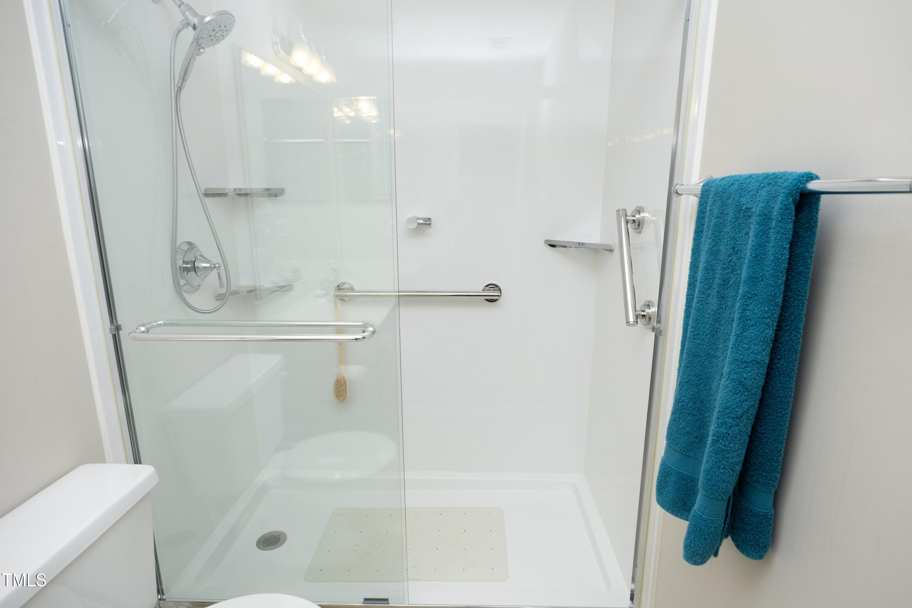 5513 Edgebury Road Raleigh, NC 27613 - Photo 23 of 34 a bathroom with a shower