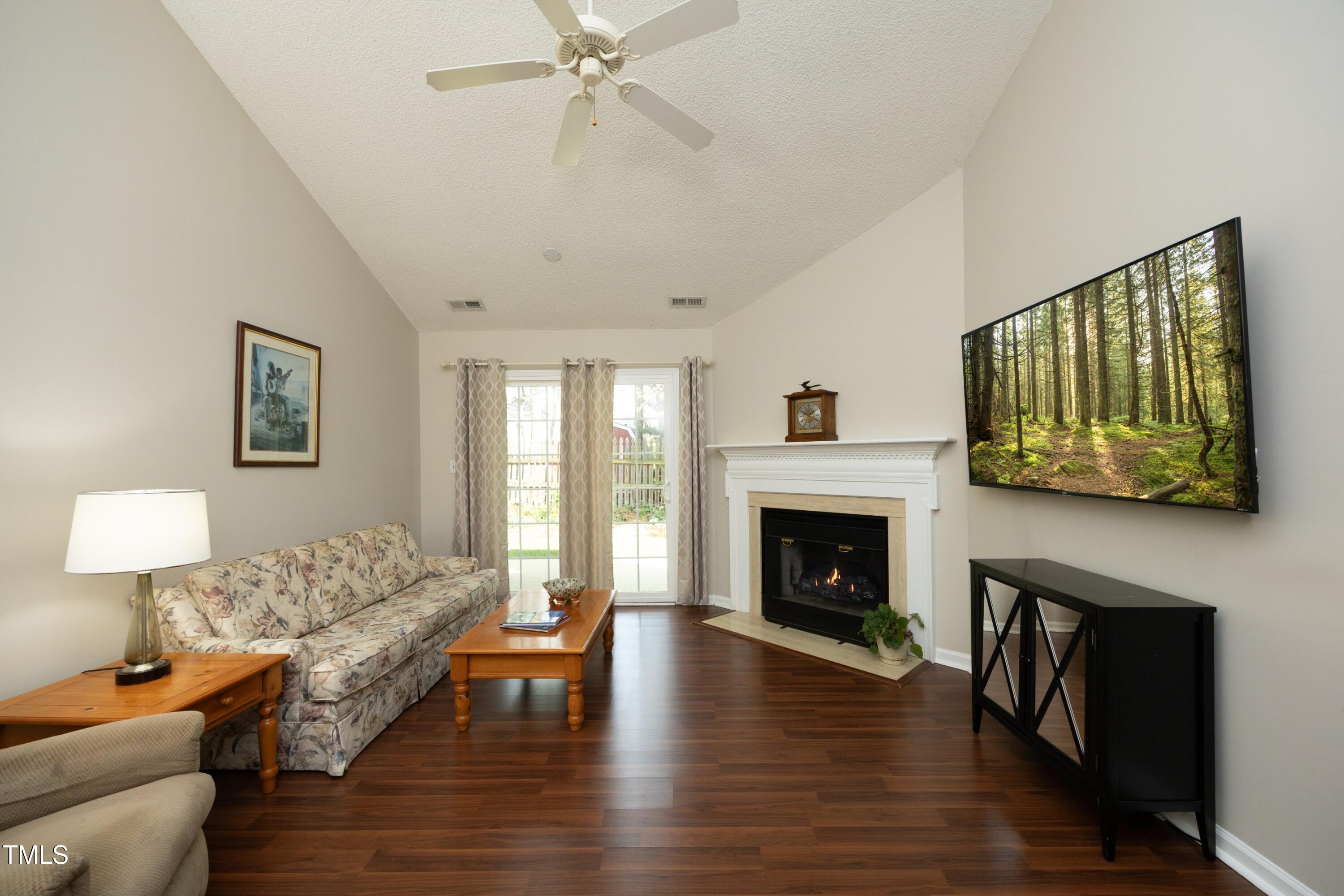 5513 Edgebury Road Raleigh, NC 27613 - Photo 2 of 34 a living room with furniture and a fireplace