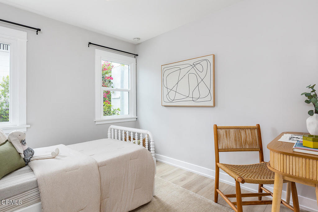 2040 North Madison Avenue Altadena, CA 91001 - Photo 21 of 35 a bedroom with a bed and a window
