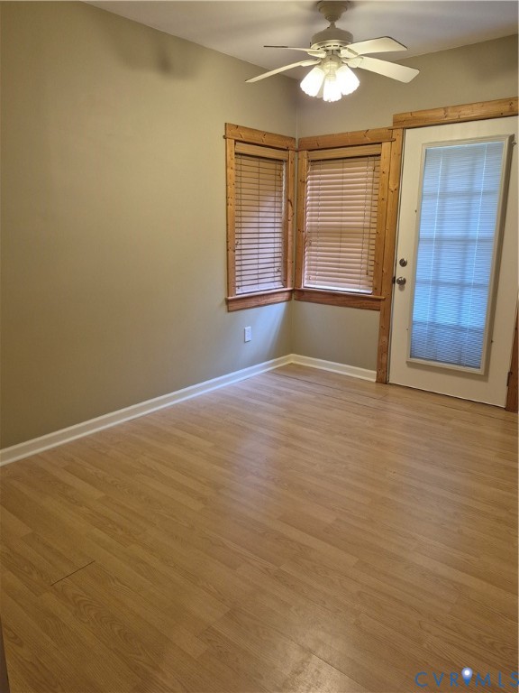 15731 Cooks Mill Road Lanexa, VA 23089 - Photo 8 of 14 Light wood-finish flooring with white baseboards,