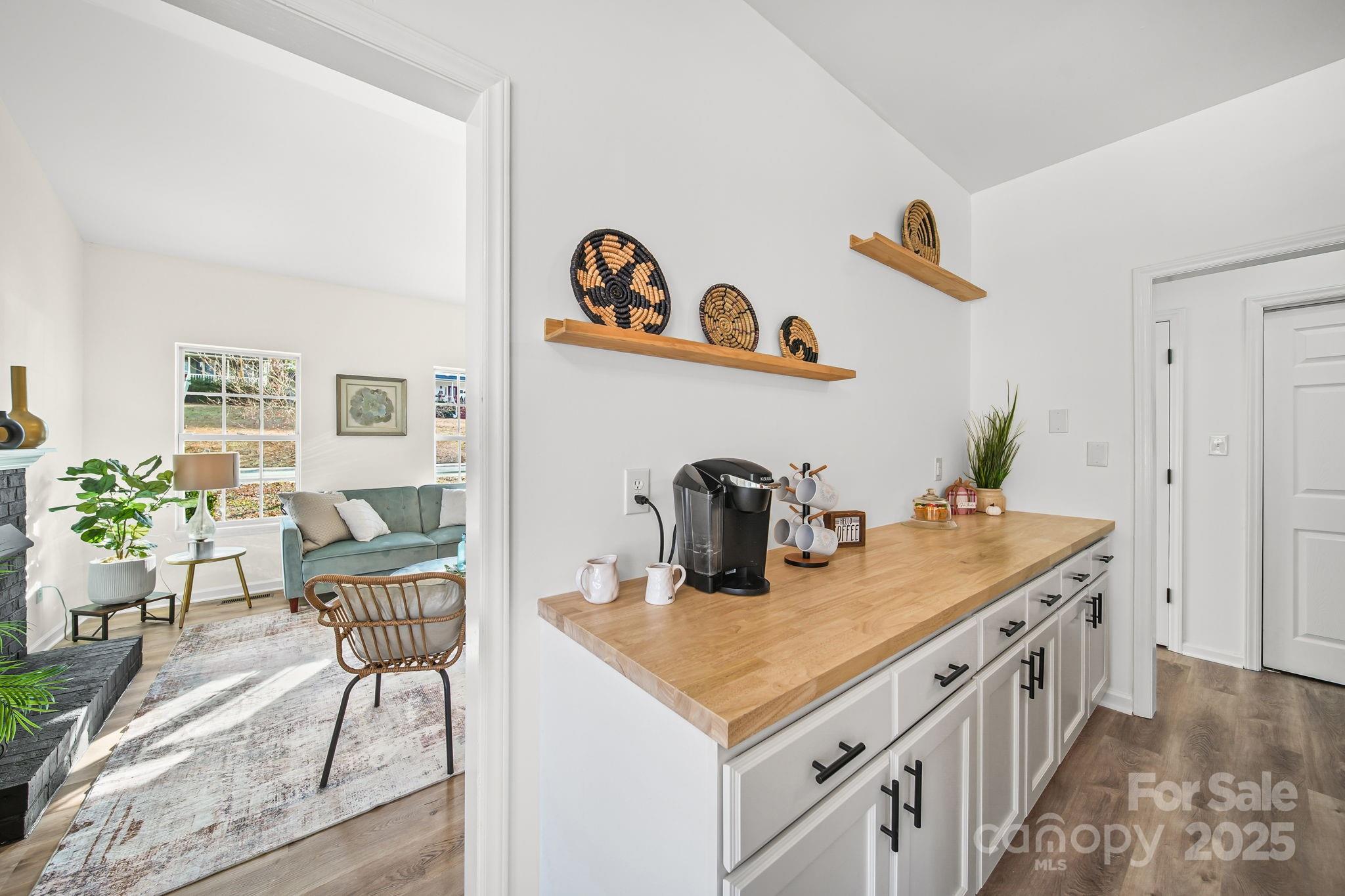 2120 Crosstrail Ridge Rock Hill, SC 29732 - Photo 5 of 12 a view of a kitchen area with furniture and wooden floor
