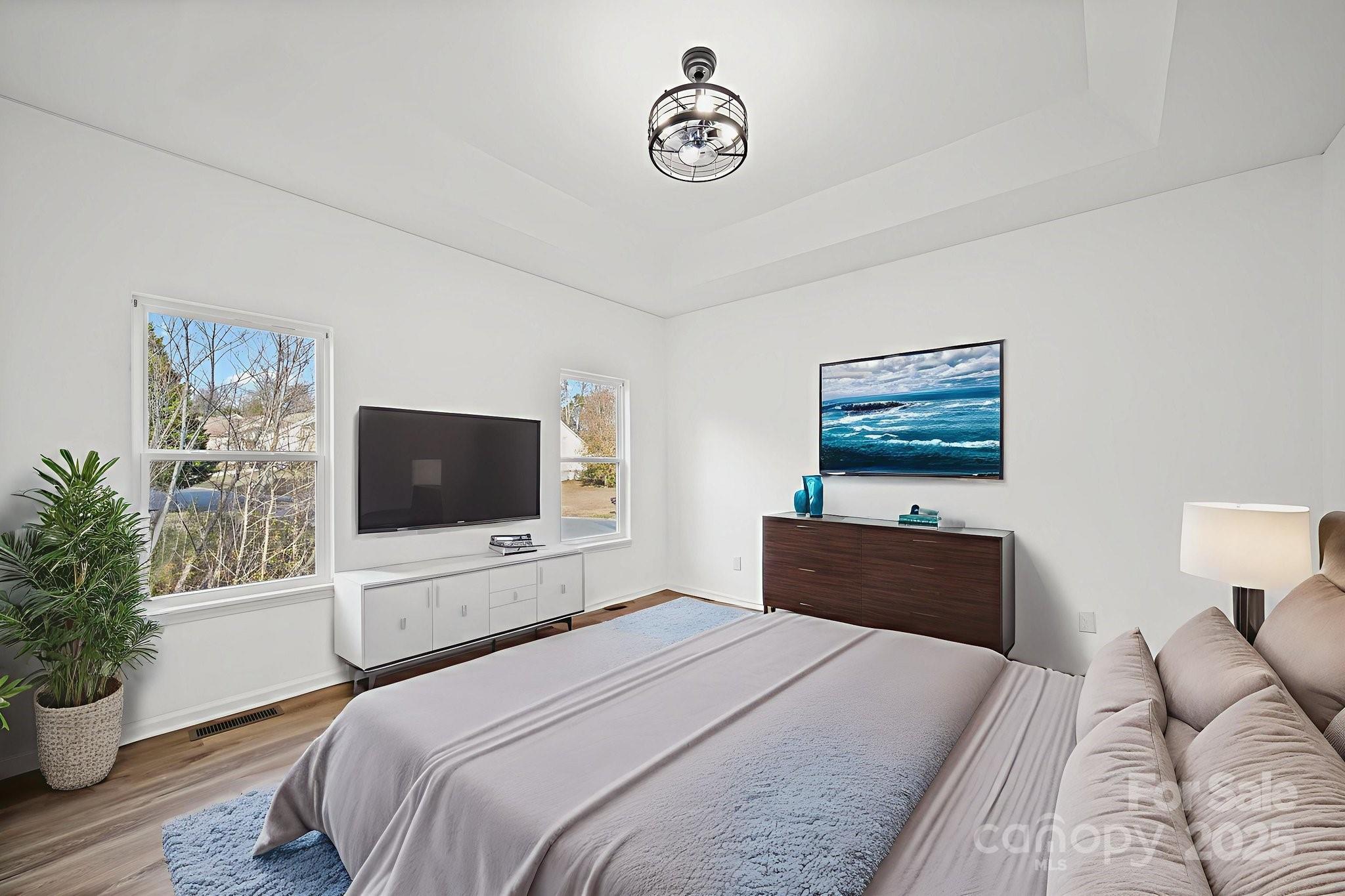 2120 Crosstrail Ridge Rock Hill, SC 29732 - Photo 7 of 12 a bedroom with a bed and a flat screen tv