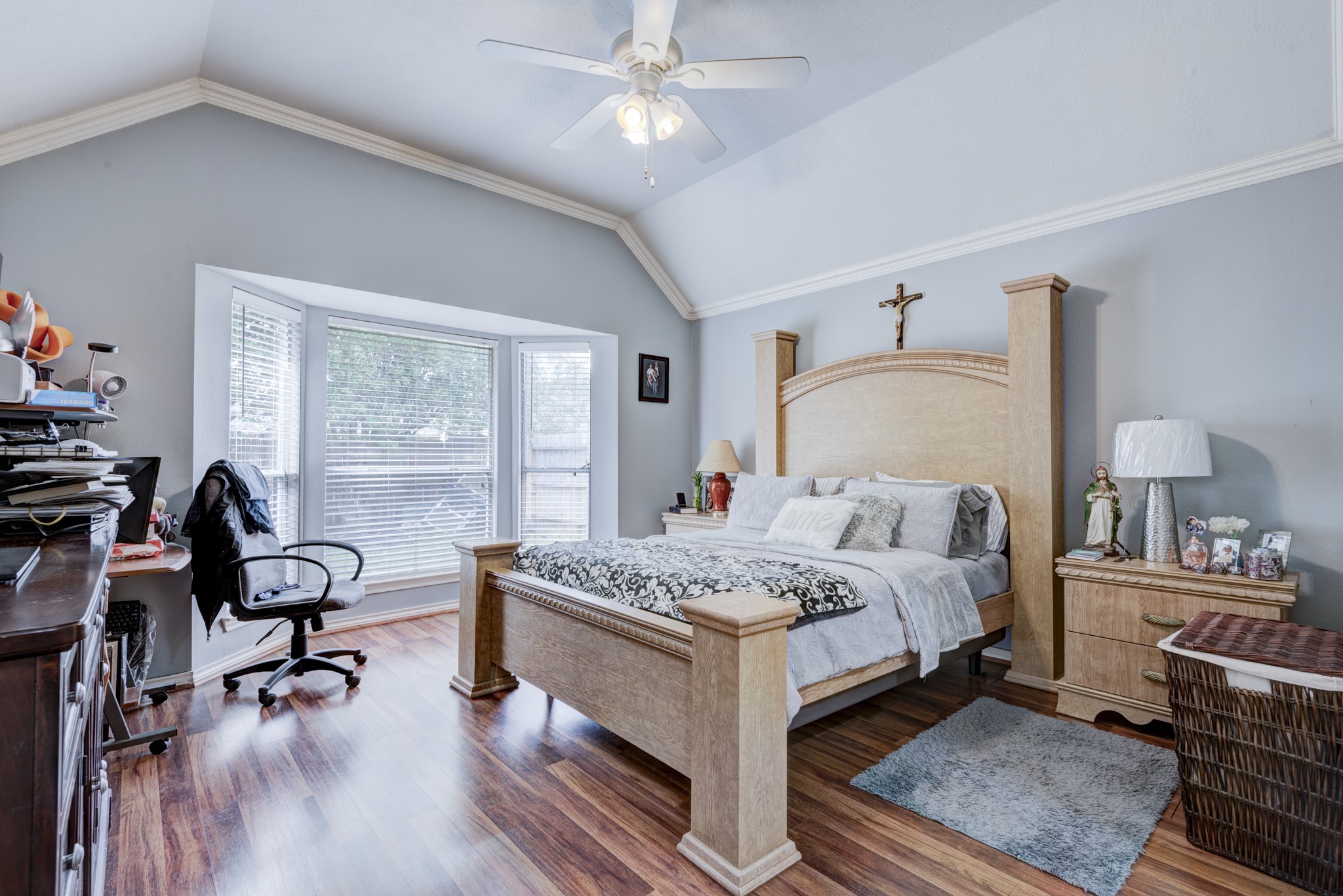 6723 Greenhouse Road Katy, TX 77449 - Photo 9 of 15 a bedroom with a bed and a chandelier