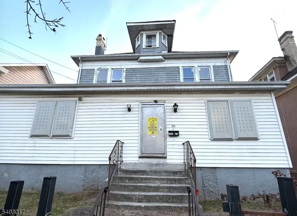 a front view of a house with a balcony