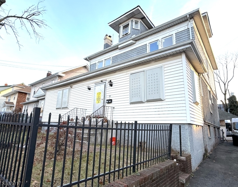 66 Scheerer Avenue Newark, NJ 07112 - Photo 2 of 24 a view of a house with a balcony