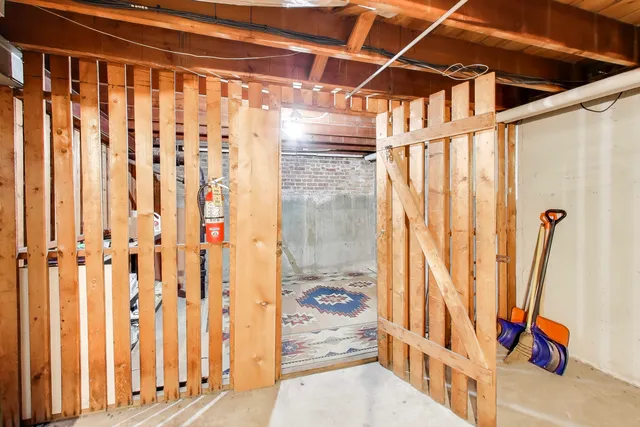 a view of an entryway with wooden floor and door