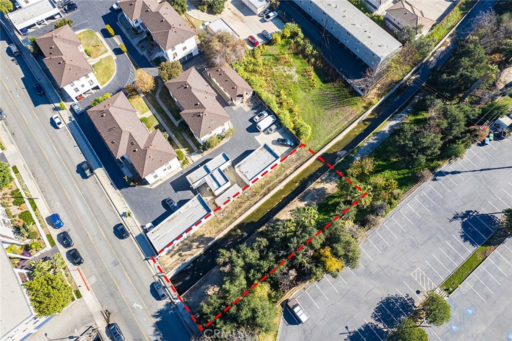 an aerial view of a residential apartment building with a yard