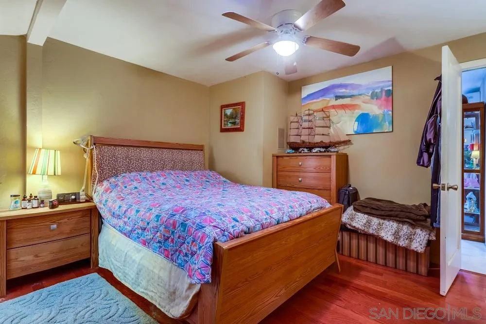 17745 Highway 67 Ramona, CA 92065 - Photo 11 of 24 a bedroom with a bed and a chandelier