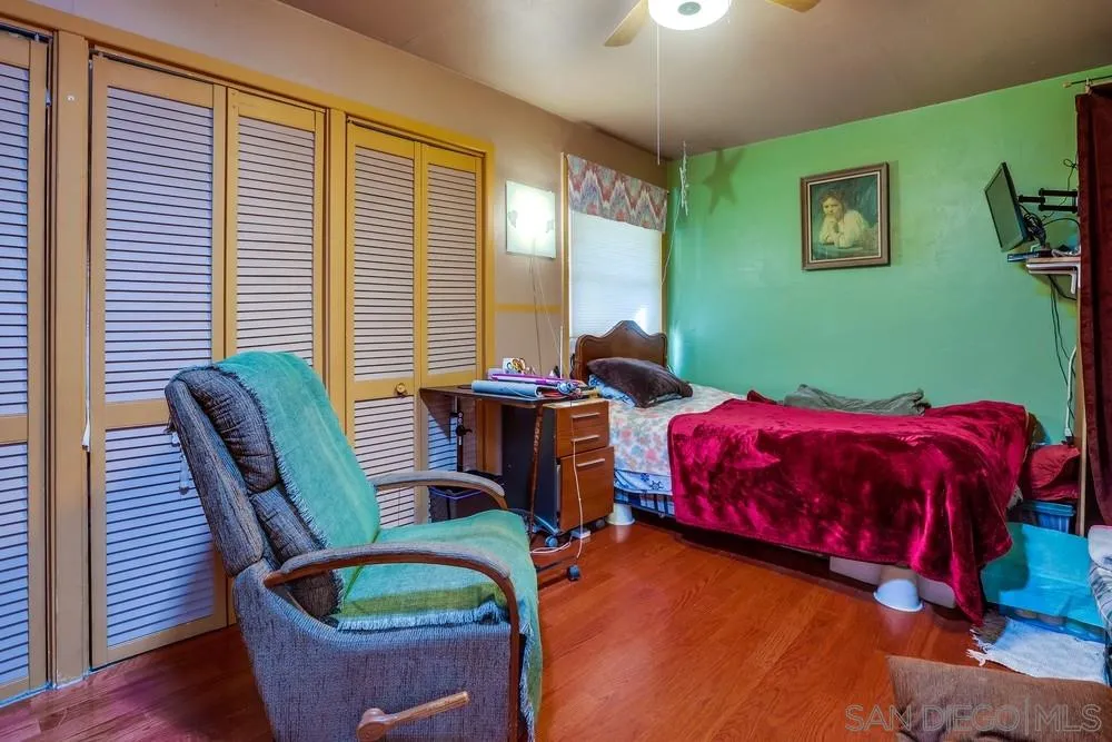 17745 Highway 67 Ramona, CA 92065 - Photo 13 of 24 a bedroom with furniture and a potted plant