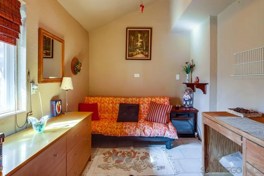 17745 Highway 67 Ramona, CA 92065 - Photo 15 of 24 a bedroom with a bed and a couch