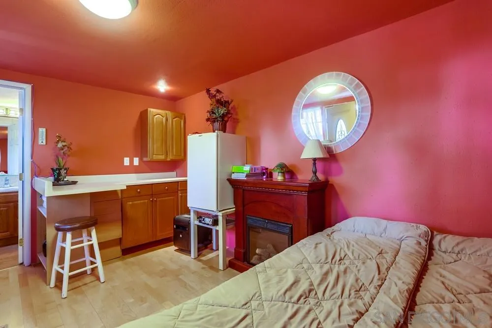 17745 Highway 67 Ramona, CA 92065 - Photo 16 of 24 a bed room with a bed and a table