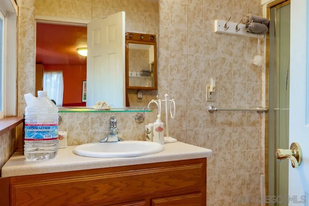 17745 Highway 67 Ramona, CA 92065 - Photo 17 of 24 a bathroom with a sink and a mirror