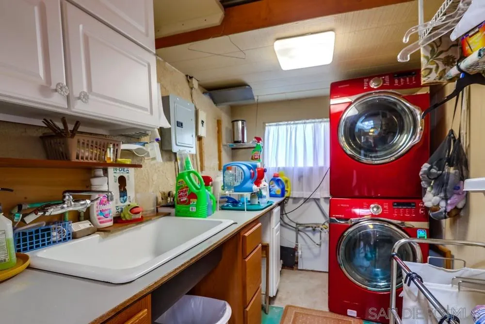 17745 Highway 67 Ramona, CA 92065 - Photo 18 of 24 a utility room with dryer washer and a view of living room