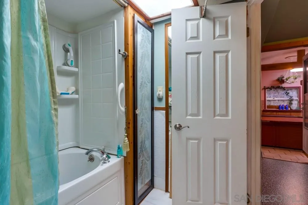 17745 Highway 67 Ramona, CA 92065 - Photo 10 of 24 a bathroom with a tub shower and sink