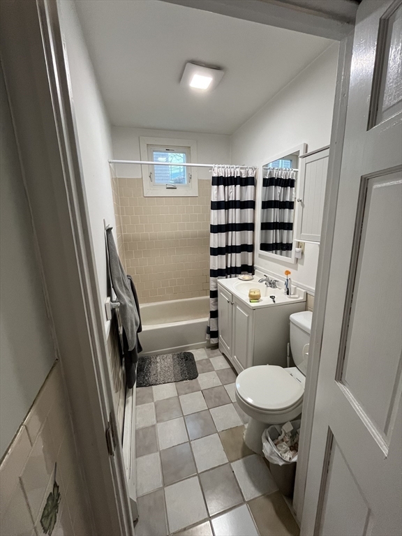 63 Marshfield Street, Unit 1 Boston, MA 02119 - Photo 14 of 26 a bathroom with a toilet a sink and a shower