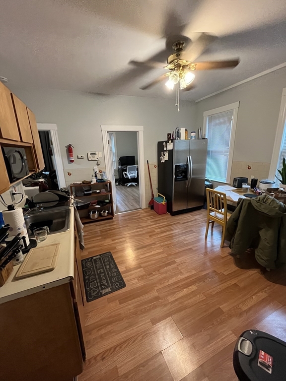 63 Marshfield Street, Unit 1 Boston, MA 02119 - Photo 15 of 26 a living room with furniture and a flat screen tv