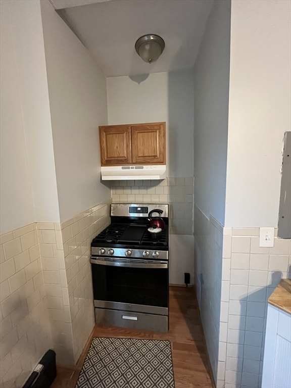 63 Marshfield Street, Unit 1 Boston, MA 02119 - Photo 17 of 26 a view of a hallway with washer and dryer